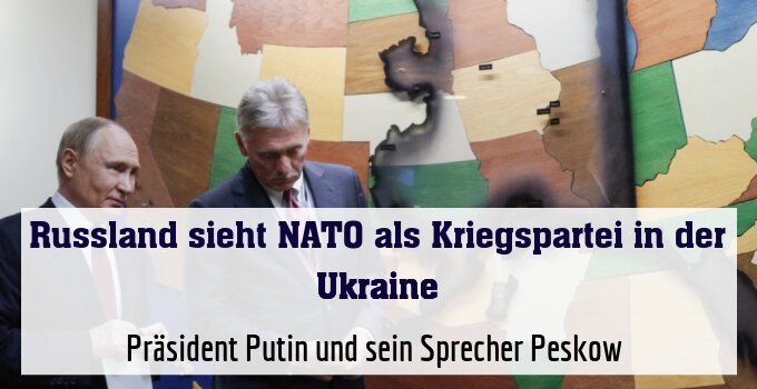 Präsident Putin und sein Sprecher Peskow (rechts)