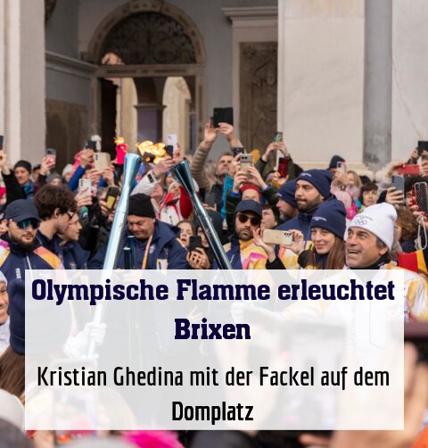 Kristian Ghedina mit der Fackel auf dem Domplatz